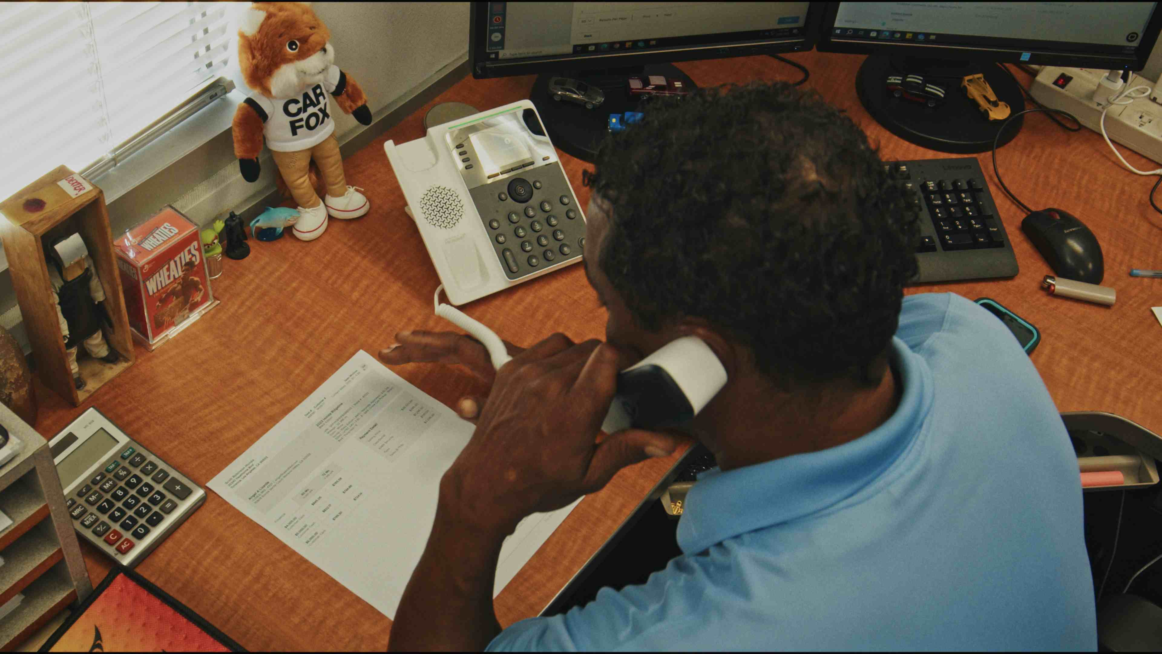 Dealership team member on phone with customer