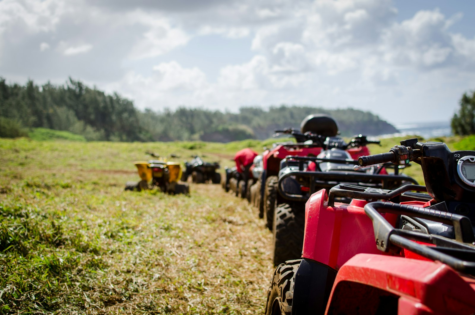 A row of ATVs lined up side by side ready for the season