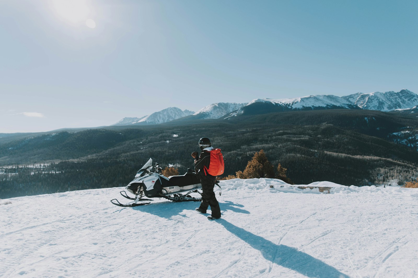 A snowmobile resting in deep snow during the powersports off-season